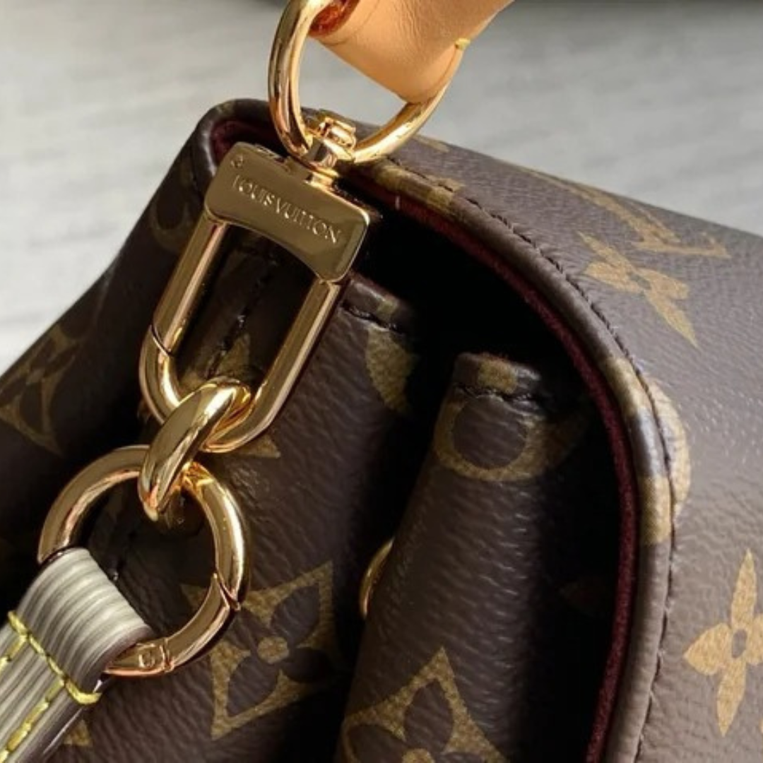 LOUIS VUITTON – CARTERA HIDE AWAY MM