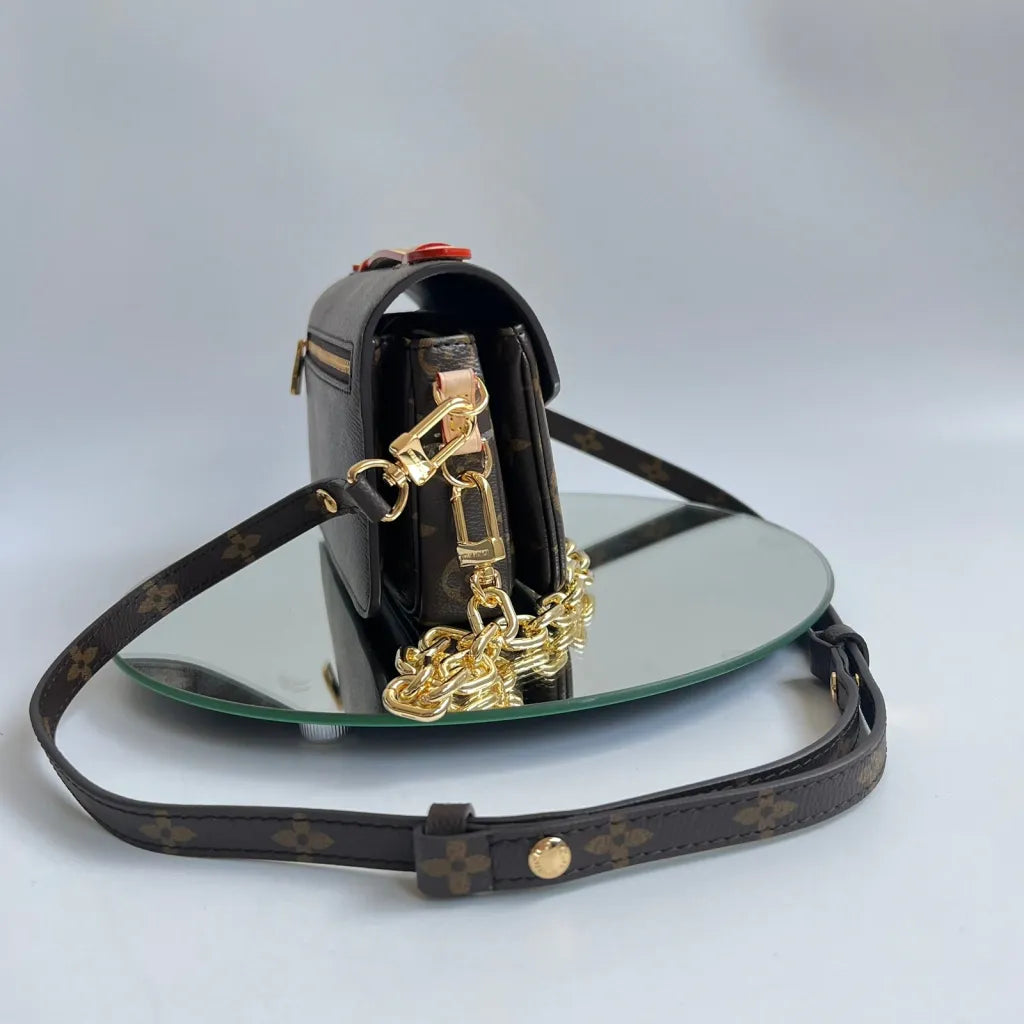 LOUIS VUITTON – EAST WEST MÉTIS CLUTCH